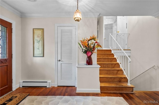 entrance foyer with wood finished floors, a baseboard radiator, ornamental molding, baseboards, and stairway