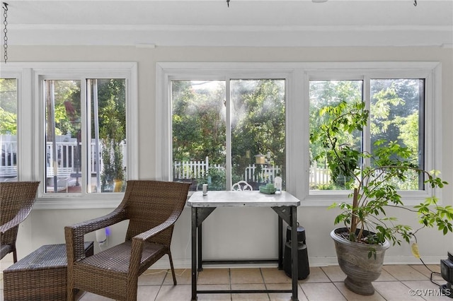 sunroom / solarium featuring tile patterned floors and a wealth of natural light