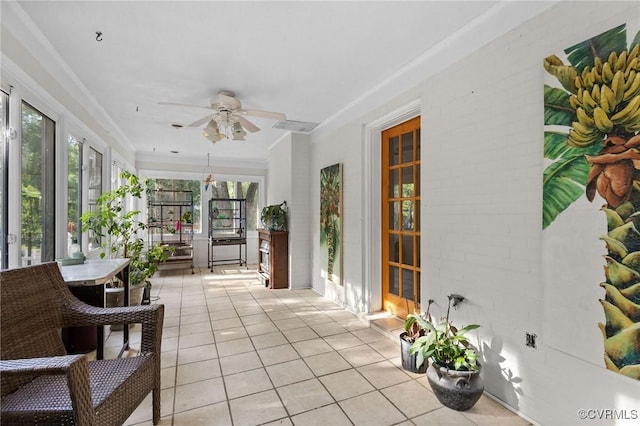 sunroom / solarium featuring tile patterned flooring and french doors