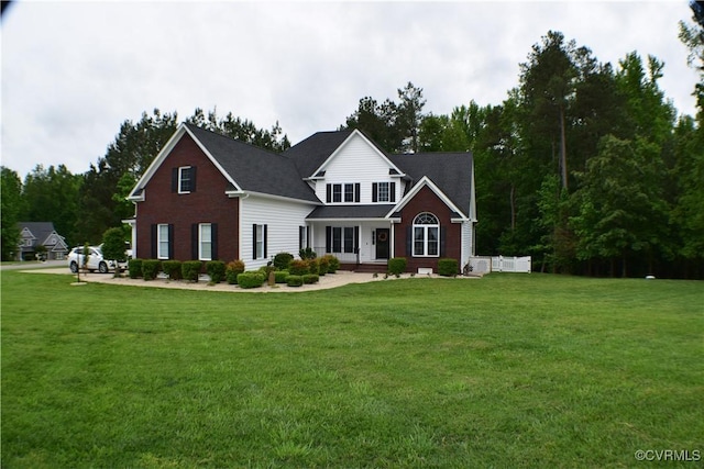 8313 Kalliope Ct, Chesterfield, VA 23838 - traditional-style house with a front yard and brick siding