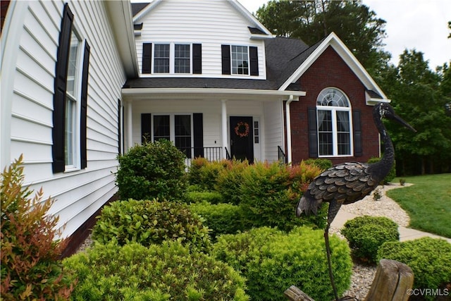 8313 Kalliope Ct, Chesterfield, VA 23838 - traditional-style house with a porch and brick siding
