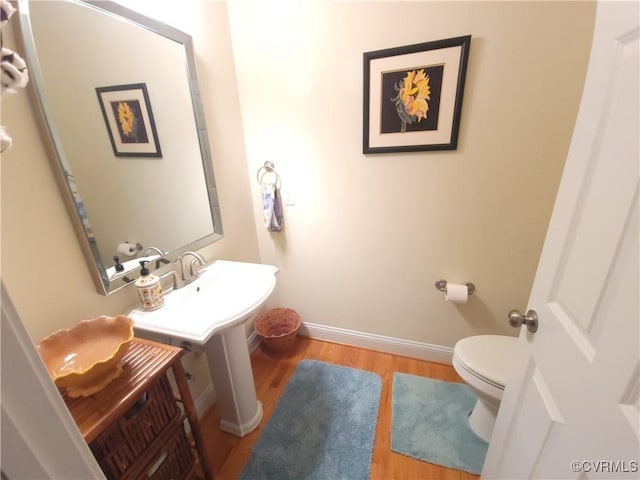 8313 Kalliope Ct, Chesterfield, VA 23838 - bathroom with wood finished floors, toilet, and baseboards