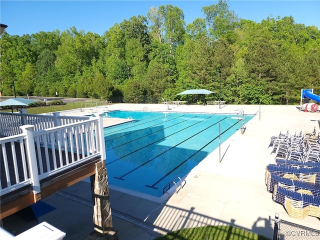 8313 Kalliope Ct, Chesterfield, VA 23838 - community pool featuring a forest view, a patio area, and fence