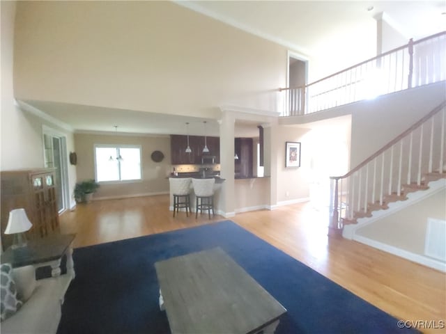 8313 Kalliope Ct, Chesterfield, VA 23838 - living room with wood finished floors, stairway, and a towering ceiling