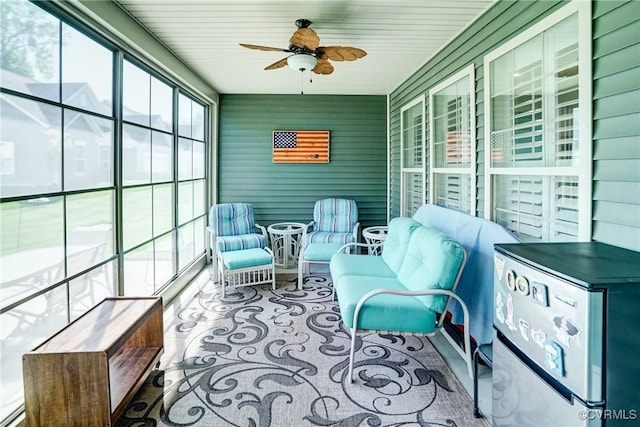 sunroom featuring ceiling fan