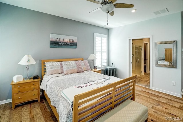 bedroom with baseboards, a ceiling fan, wood finished floors, and visible vents