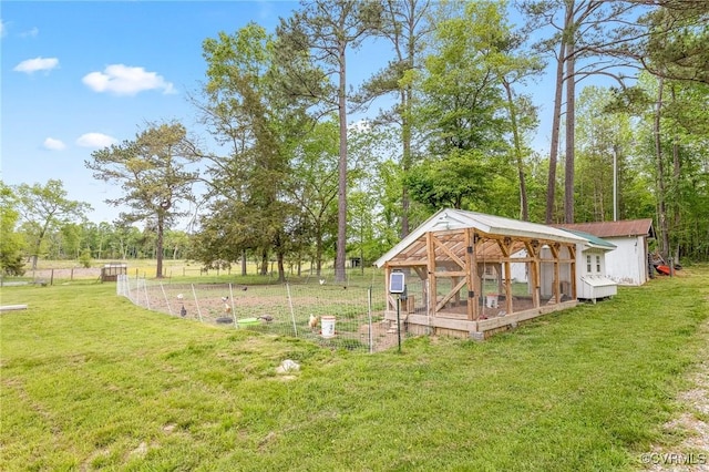 view of yard featuring exterior structure and an outbuilding