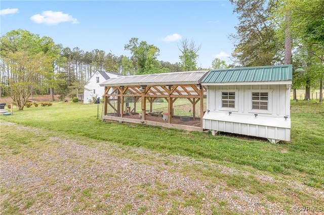 view of yard with an outdoor structure and exterior structure
