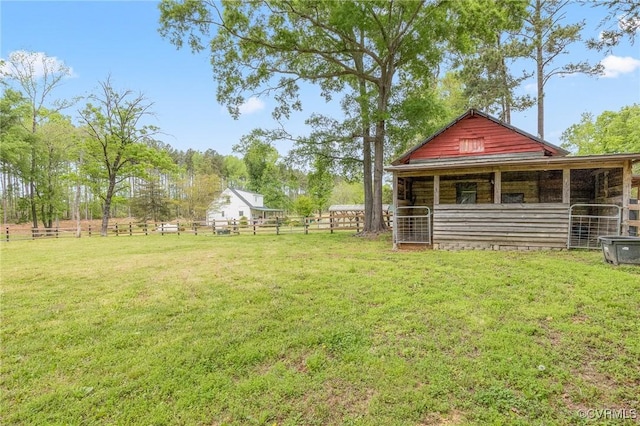 view of yard with an outdoor structure and an exterior structure