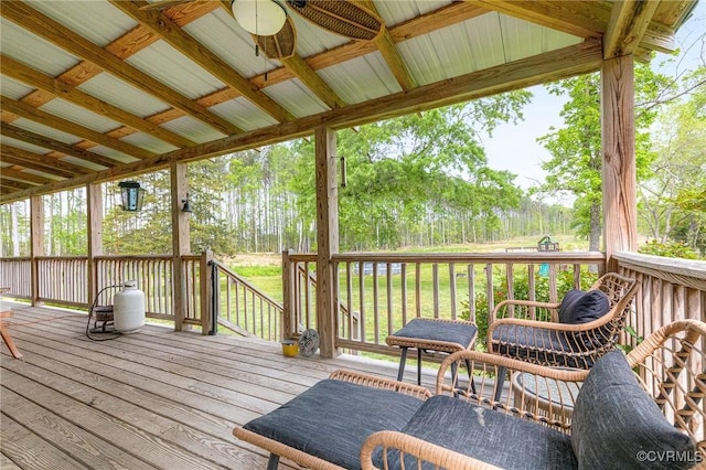 wooden deck featuring a ceiling fan
