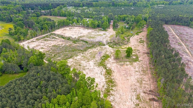 bird's eye view featuring a forest view