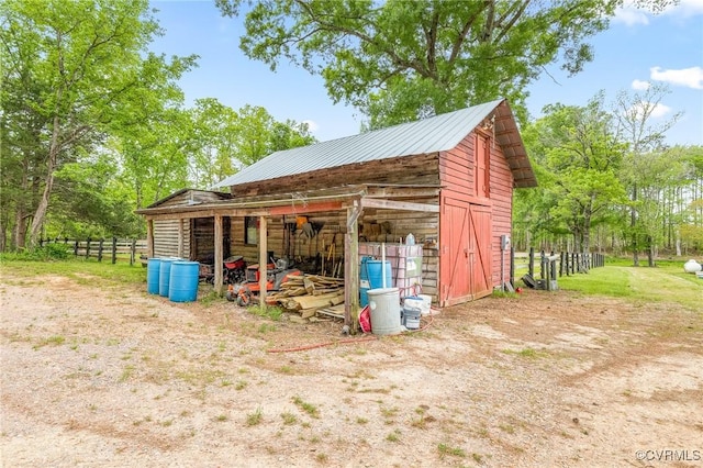 view of outdoor structure with an outdoor structure and fence