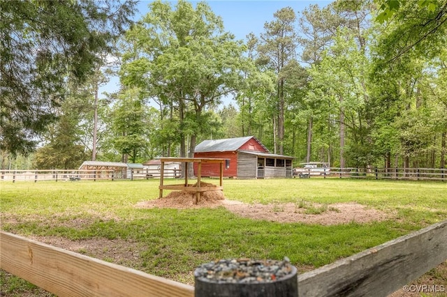 view of yard featuring an outdoor structure and an exterior structure