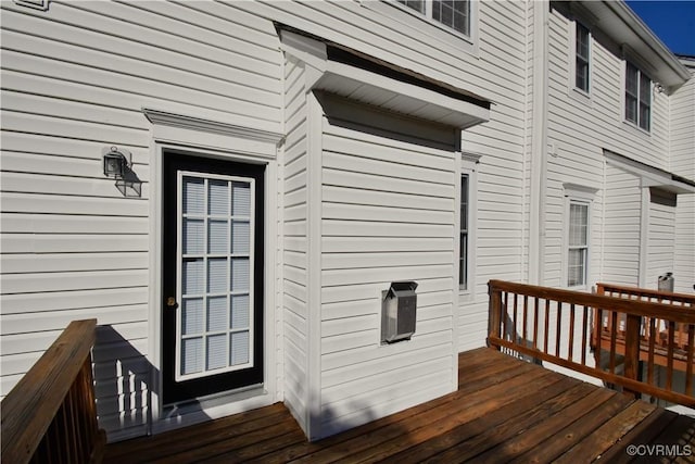 entrance to property with a wooden deck