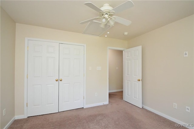 unfurnished bedroom with carpet floors, baseboards, a closet, and ceiling fan