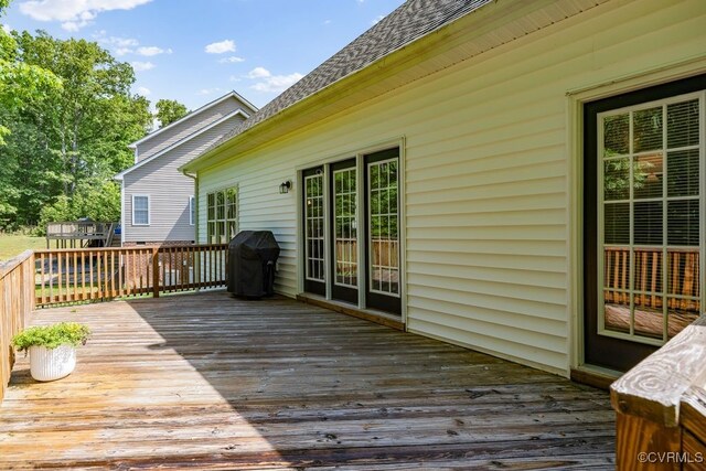 deck featuring a grill