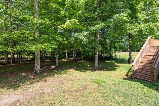 view of yard featuring stairway