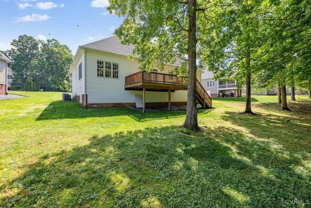 back of house with a deck, a lawn, cooling unit, and stairway