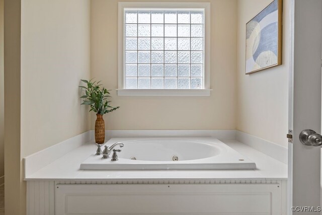 bathroom featuring a whirlpool tub