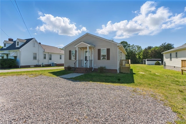 bungalow-style house with a front yard