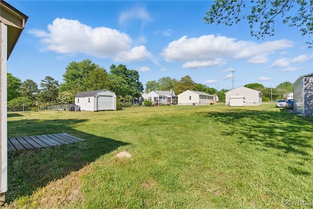 view of yard featuring a storage unit and an outbuilding