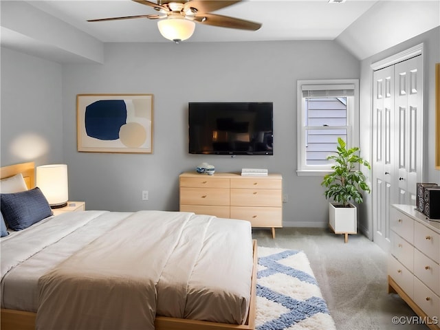 carpeted bedroom featuring baseboards, ceiling fan, and lofted ceiling