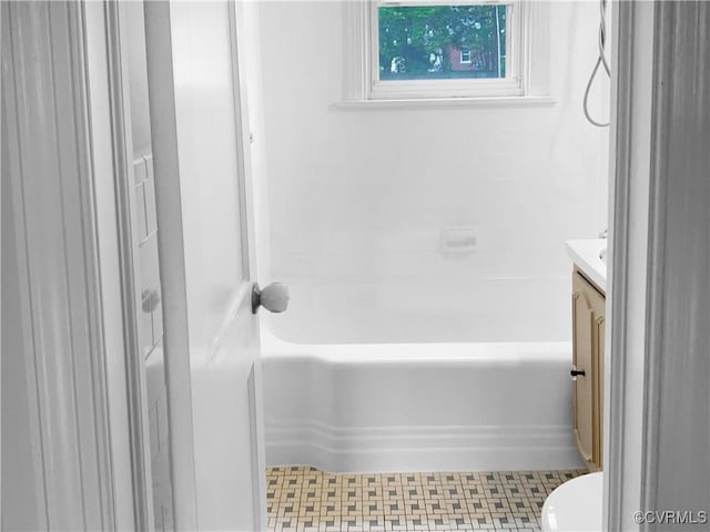 full bathroom with a bath and vanity