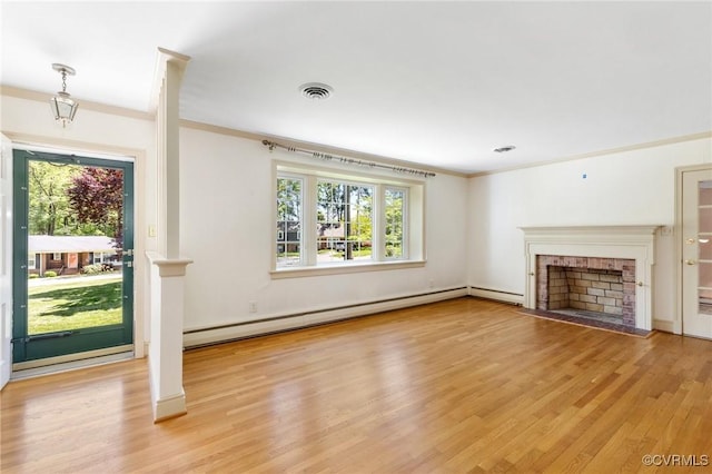 unfurnished living room featuring visible vents, plenty of natural light, ornamental molding, and light wood-style floors