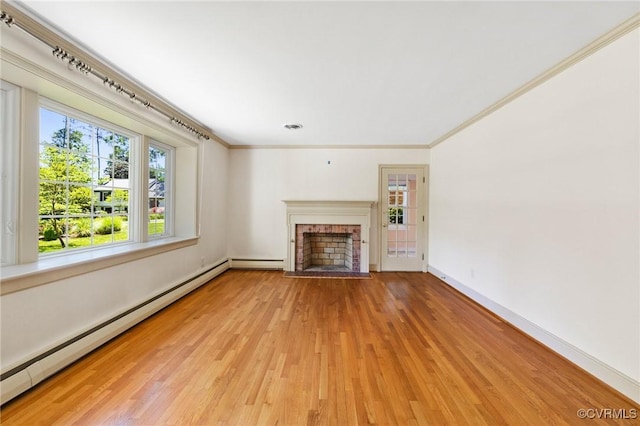 unfurnished living room featuring baseboard heating, a brick fireplace, baseboards, ornamental molding, and light wood-style flooring