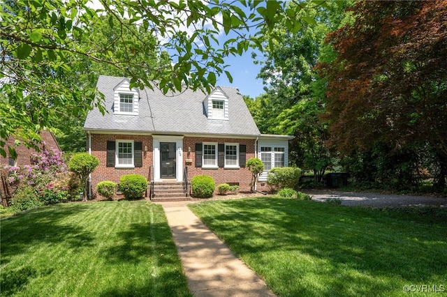 new england style home with brick siding and a front lawn