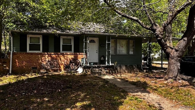 view of front of home featuring brick siding
