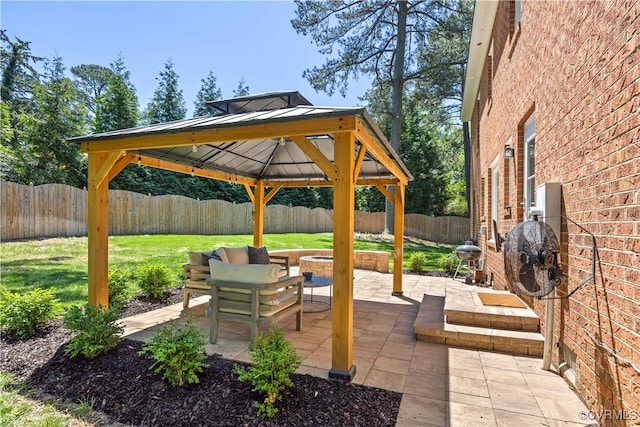 view of patio / terrace with a gazebo and a fenced backyard