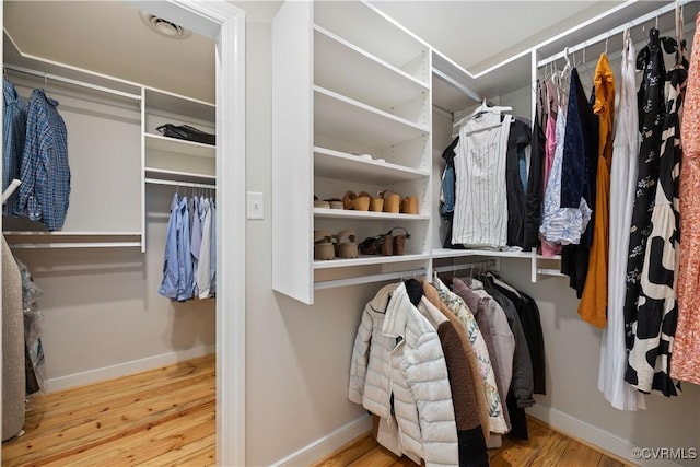 spacious closet with wood finished floors