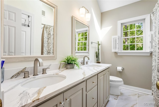 bathroom with toilet, visible vents, a sink, and marble finish floor