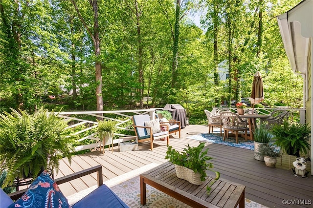 wooden deck featuring outdoor dining space