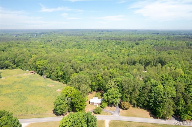 birds eye view of property with a wooded view