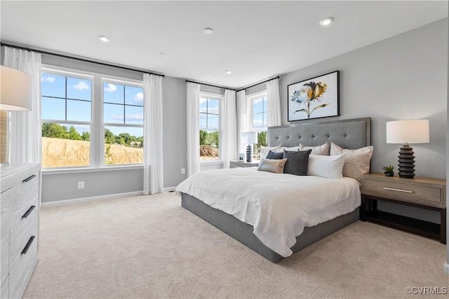 bedroom with baseboards and carpet flooring