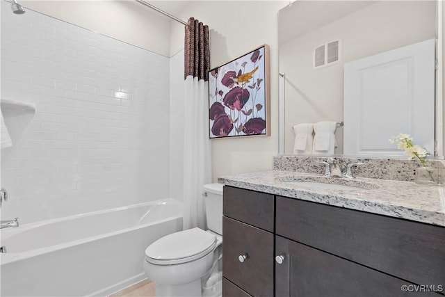 bathroom featuring vanity, shower / bath combination with curtain, toilet, and visible vents