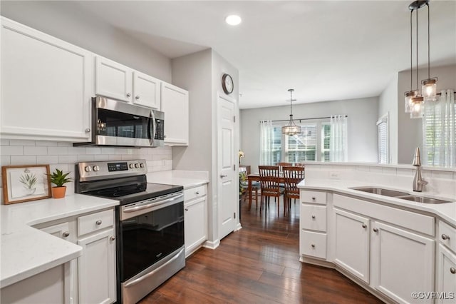 14000 Briars Cir Unit 202, Midlothian, VA 23114 - kitchen featuring dark wood-style flooring, light countertops, tasteful backsplash, a sink, and stainless steel appliances