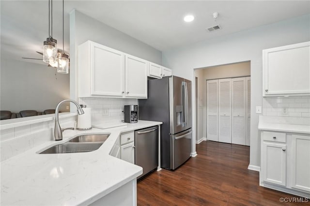 14000 Briars Cir Unit 202, Midlothian, VA 23114 - kitchen featuring white cabinets, a sink, stainless steel appliances, backsplash, and visible vents