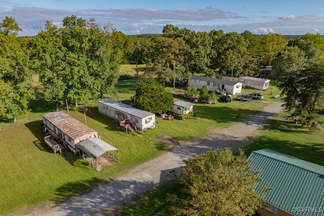drone / aerial view featuring a wooded view