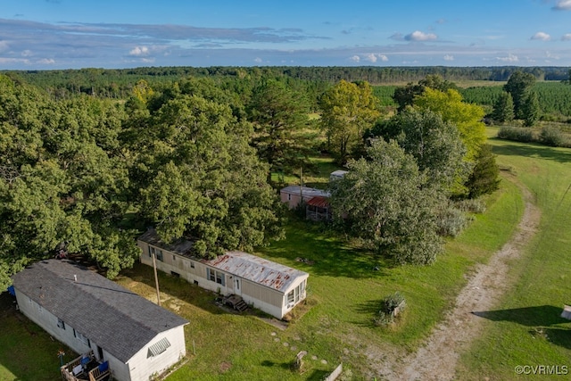 aerial view featuring a wooded view