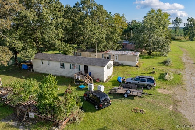 rear view of house with a yard