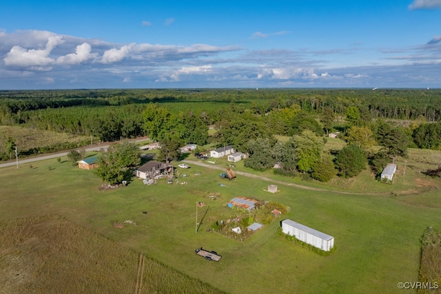 drone / aerial view featuring a rural view and a forest view