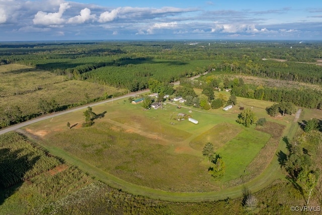 birds eye view of property featuring a wooded view