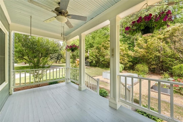 deck featuring a porch and a ceiling fan