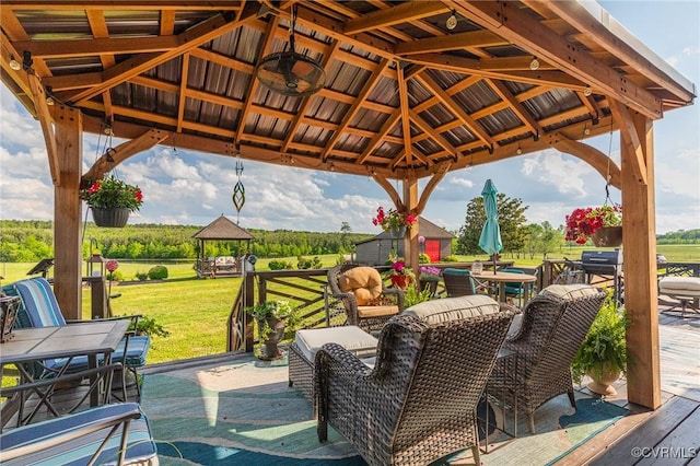 view of patio with a gazebo and outdoor dining area