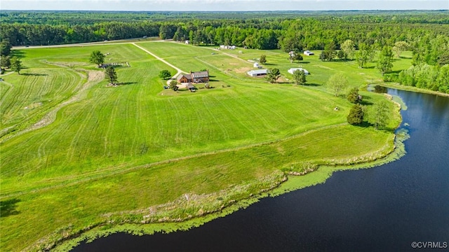birds eye view of property with a water view, a rural view, and a forest view