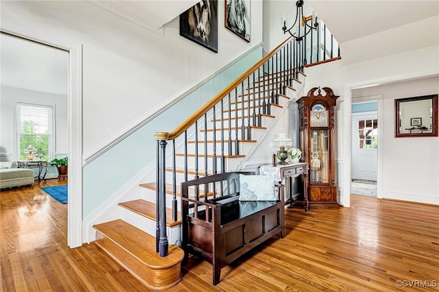 stairs featuring baseboards and wood finished floors
