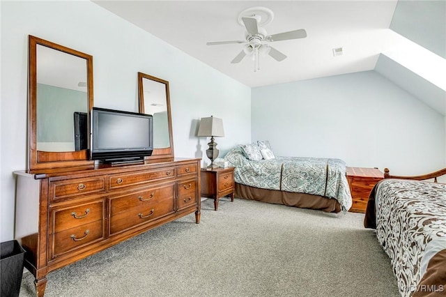 bedroom featuring vaulted ceiling, a ceiling fan, carpet flooring, and visible vents